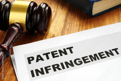 Patent infringement and gavel. Copyright law concept.