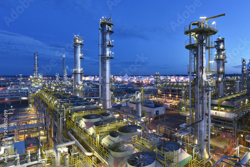 industrial plant refinery at night - production and processing of crude oil 