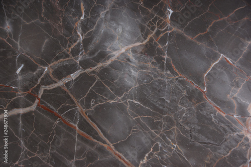 Brown marble with pink and red veins, called Caravaggio