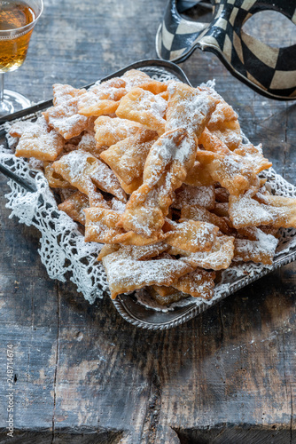 Traditional Italian carnival fritters dusted with icing sugar - frappe or chiacchiere