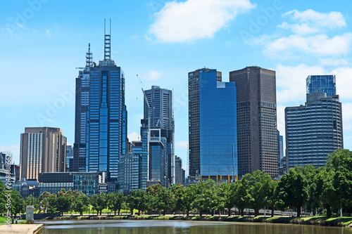 the skyline of the Melbourne, Australia central business district with the Yarra River in the foreground.