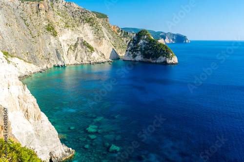Greece, Zakynthos, Blue waters surrounding plakaki island at cliffs near agalas