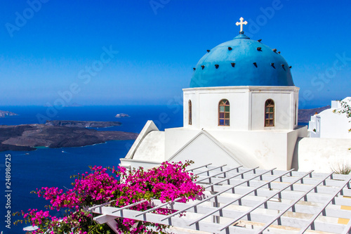 Flowers with Blue Dome Church on Santorini