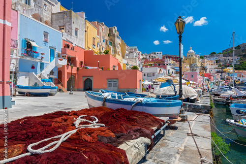 Pretty fishing village, colourful fishermen's houses, and fishing nets, Marina Corricella Procida Island, Bay of Naples, Italy.