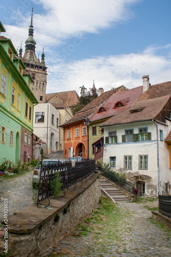 Cobble street with colored houses in Sighisoara, Romania