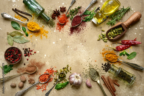 Assortment of natural spices on a spoons. Top view with copy space.