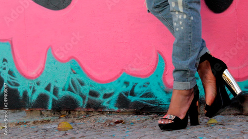 High heels and urban wall. Art and fashion