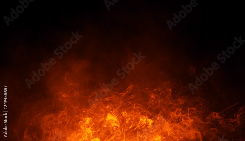 Texture of burn fire with particles embers. Flames on isolated black background. Texture for banner,flyer,card