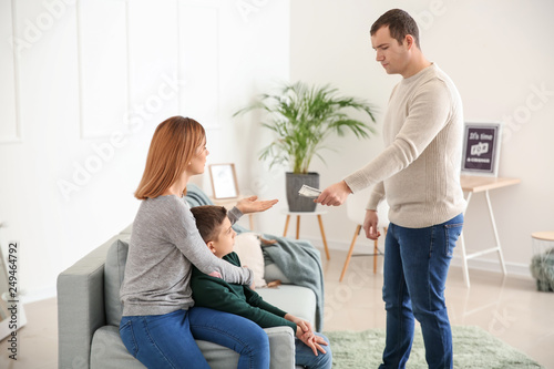 Man giving alimony to his ex-family at home