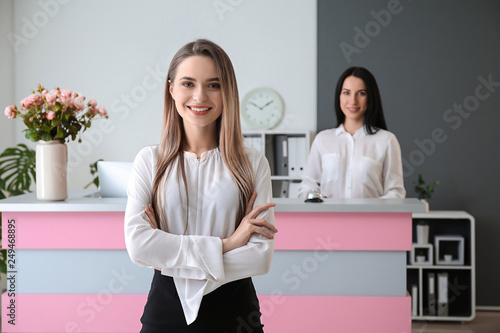 Young female receptionist in hotel