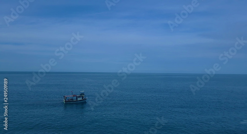 Fishing boat on the sea with blue sky