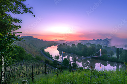 Lake Max-eyth-see and river neckar viewpoint at sunrise with purple sky, vineyard, sun, stuttgart before sunrise