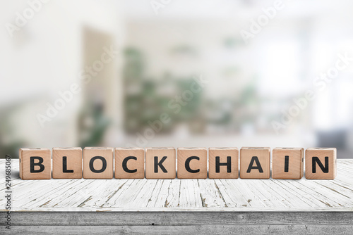 Blockchain sign made of wood on a desk