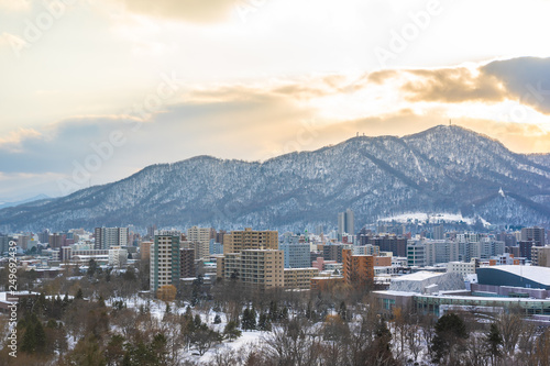 Beautiful architecture building with mountain landscape in winter season at sunset time