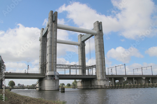 Gouwespoor vertical lifting bridge over canal Gouwe at Gouda for trains in the Netherlands