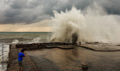 Storm waves over a pier in the Adler, Sochi