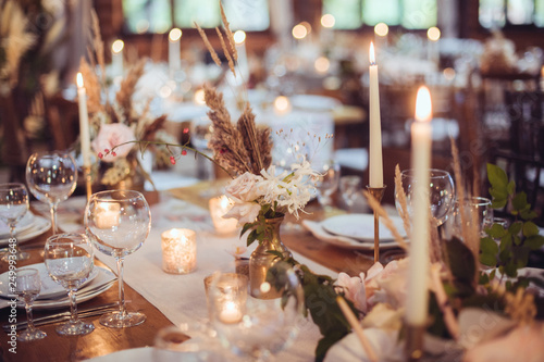 rustic wedding decorations with flowers and candles. banquet decor. picture with soft focus