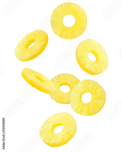 Falling pineapple slice, ring, isolated on white background, clipping path, full depth of field
