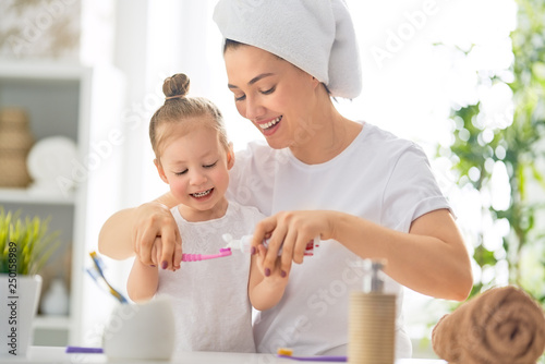 family are brushing teeth