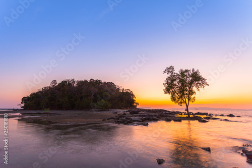 sunset at Kwang island. Kwang island is in the middle of Kwang beach Krabi Thailand.when low tide can walk to Kwang island