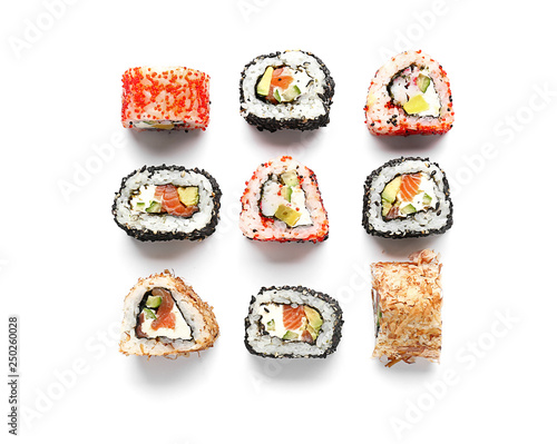 Tasty sushi rolls on white background