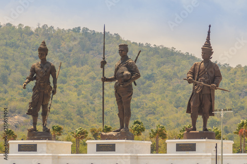Prachuap Khiri Khan, Thailand - March 16, 2017: The bronze statues three of seven Thai kings in the mountain and blue sky background at Rajabhakti Park nearby Khao Takiab hills and Hua Hin beach.