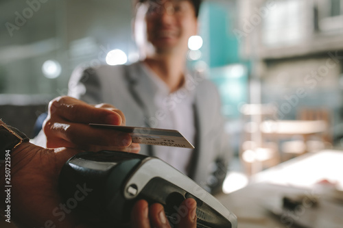 Businessman paying with contactless credit card