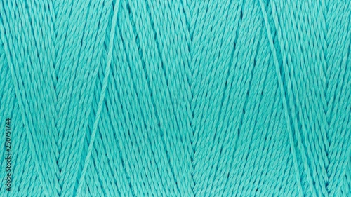 Macro picture of thread texture turquoise color background