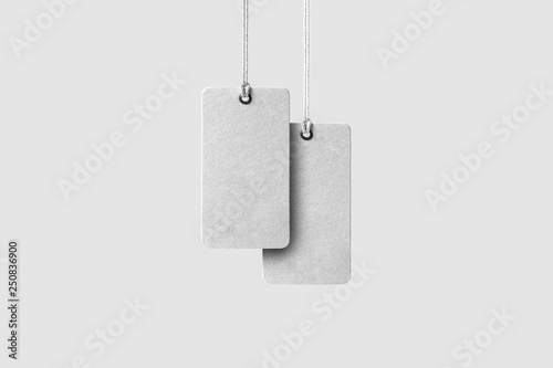Blank tag tied for hang on product for show price or discount isolate on white background with clipping path. Price tags,Cardboard labels isolated on white.