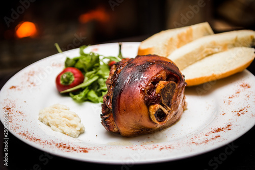 roasted pork knuckle with bread and horseradish
