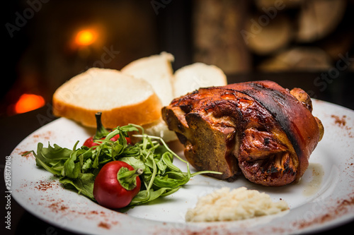 roasted pork knuckle with bread and horseradish