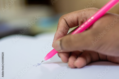 writting with pen and papper closeup of hand bokeh isolated background deforesetation trees inkpen ink letter