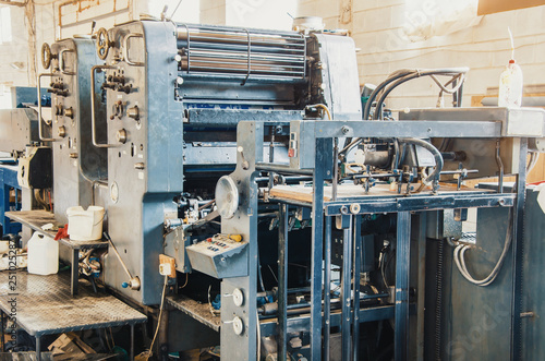 Old vintage printing machine in the print shop. Magazine, newspaper, brochure, paint.
