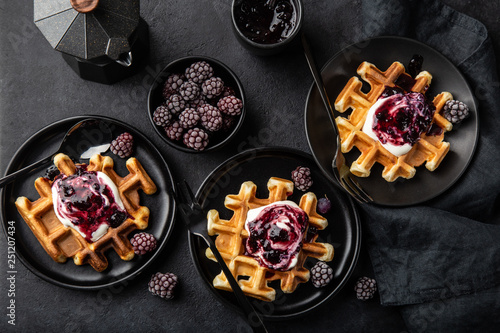 waffles with sour cream and berry sauce