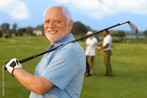 Portrait of mature male golfer