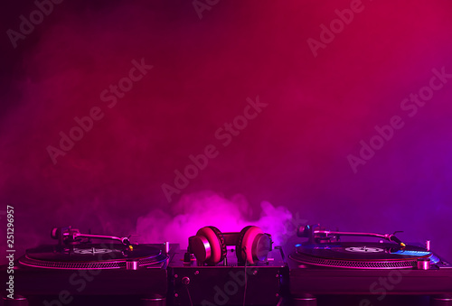 Modern DJ mixer on dark background