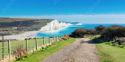 Walk to Cuckmere Haven beach near Seaford, East Sussex, England. South Downs National park. View of blue sea, cliffs, long photo banner selective focus