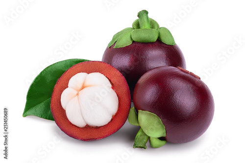 ripe mangosteen with leaves isolated on white background closeup