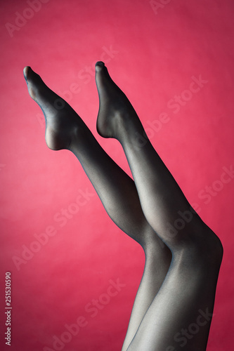 Legs of young caucasian woman in black tights