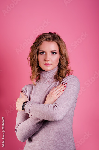 beautiful girl in a white shirt. A girl with light brown hair. Business woman. The woman in a shirt. The girl laughs. Woman surprised . woman in pink background