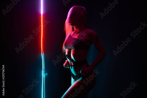 Pole dance girl with perfect body in black sexy lingerie. Night club concept