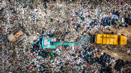 Garbage pile in trash dump or landfill abundance, Aerial view garbage truck unload garbage to a landfill, Biohazard global warming ecosystem and healthy environment concept.