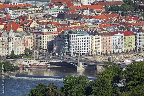 View of Dancing House from Petrin Lookout Tower in Prague, Czech Republic. The Dancing House, also named Fred and Ginger, was built in 1992-1996 in the Deconstructivism style.