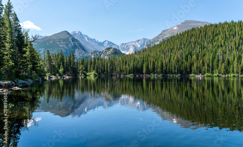 Longs Peak at Bear Lake - Longs Peak and Glacier Gorge reflecting in blue Bear Lake on a calm Summer morning, Rocky Mountain National Park, Colorado, USA.