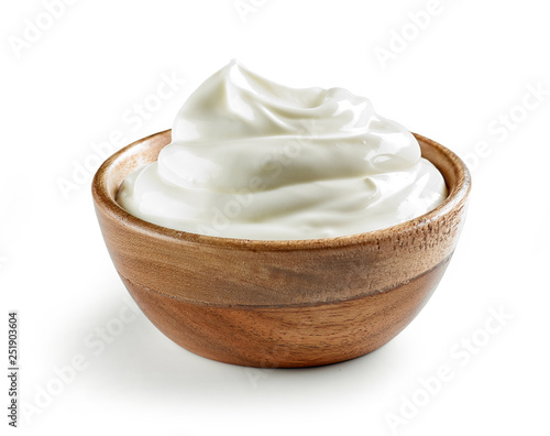 sour cream in wooden bowl