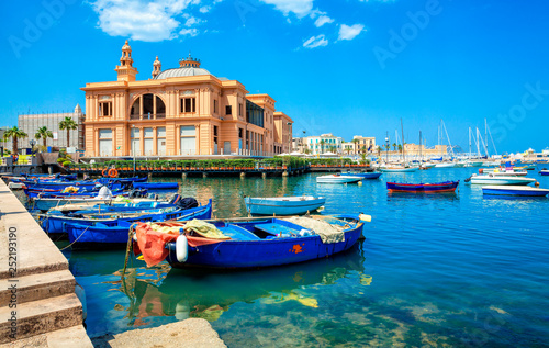 Margherita Theater and fishing boats in old harbor of Bari, Puglia, Italy. Bari is the capital city of the Metropolitan City of Bari on the Adriatic Sea, Italy. Architecture and landmark of Italy