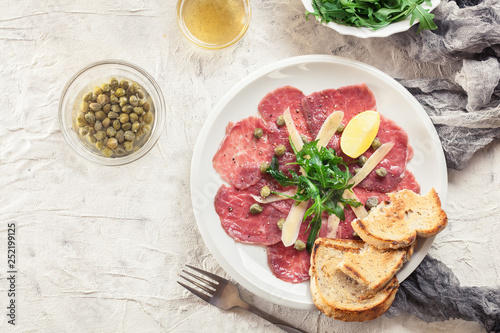 Beef carpaccio with arugula and parmesan