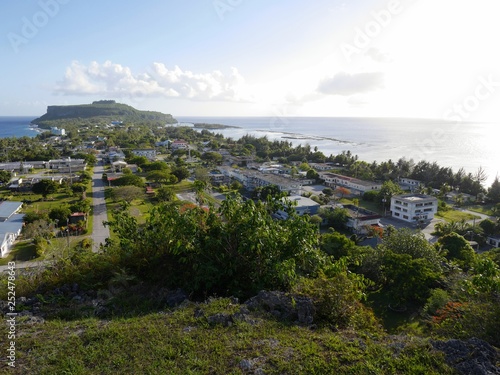 Songsong village with the Cake Mountain in the distance facing the ocean, Rota, Northern Mariana Islands.