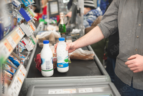 Man buying food products in the supermarket shopping