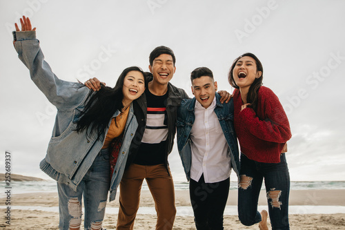 Friends having great time together at the beach